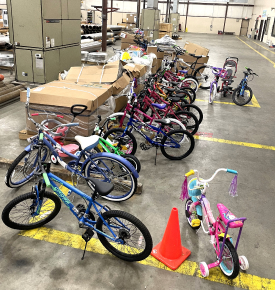 Bikes being donated during a charity event with TAM International