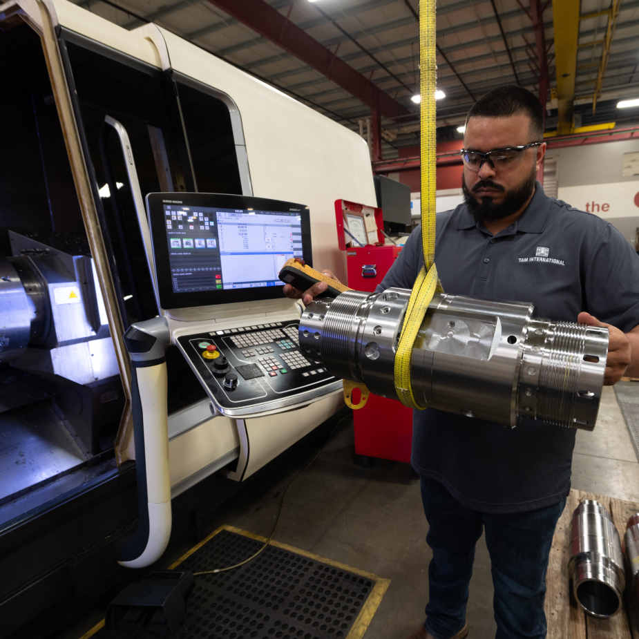 A TAM engineering using a harness to guide a piece of equipment into a machine to test it