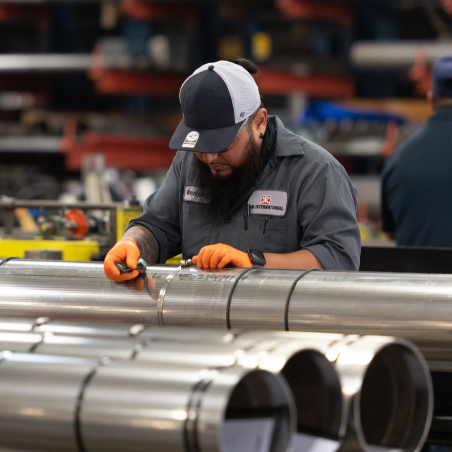 A TAM team member enscribing packer details into the piping