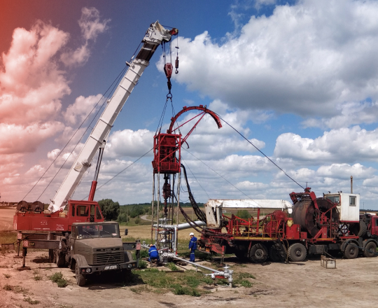 An oil derrick being built in the countryside