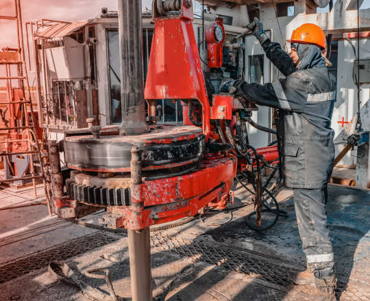 An oil rig worker preparing a TAM inflatable Bridge Plug