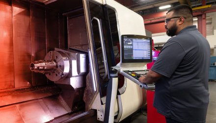 A TAM engineering preparing a machine to test a packer