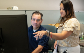 A TAM sales rep walking through downhole designs with an engineer